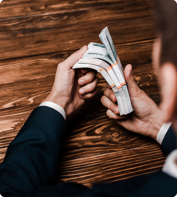 selective-focus-of-man-holding-russian-money-near-2023-01-06-06-47-00-utc 1